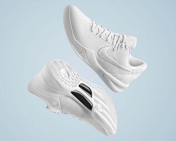 Side view of Kobe Bryant's white Nike basketball shoes.